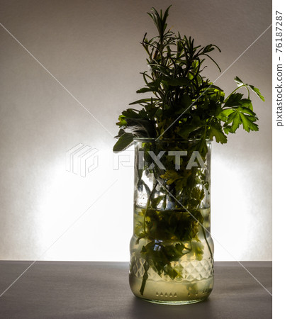 Glass with aromatic herbs Glass with aromatic herbs 76187287