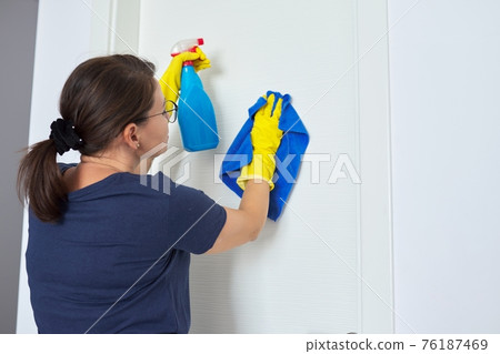 House cleaning, mature woman cleans at home House cleaning, mature woman cleans at home 76187469