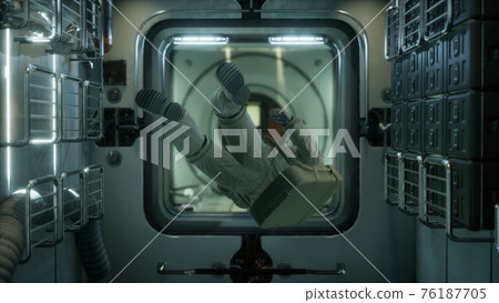 astronaut inside the orbital space station 76187705