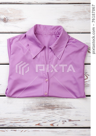 Folded purple women shirt. Folded purple women shirt. 76187867