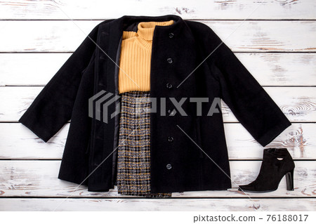 Winter women outfit with yellow woolen sweater. 76188017