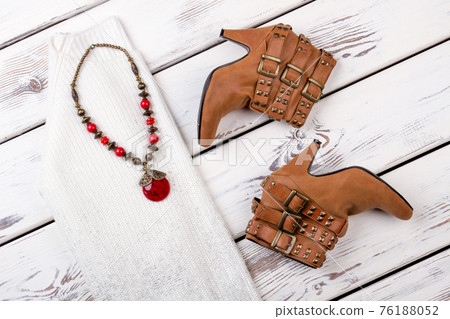 The dress with heel boots and accessories. 76188052