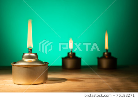 Pelita or oil lamp, traditional Malay oil lamp lit up during Ramadan and Hari Raya Aidilfitri Muslim celebration 76188271