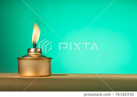 Pelita or oil lamp, traditional Malay oil lamp lit up during Ramadan and Hari Raya Aidilfitri Muslim celebration 76188330