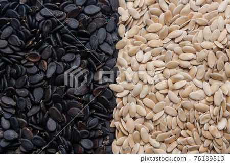 Watermelon seeds.Various varieties of watermelon seeds on a blue background 76189813