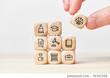 Law enforcement system building concept with laws, courts and police on wooden cubes Law enforcement system building concept with laws, courts and police on wooden cubes 76192508
