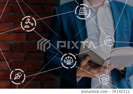 Lawyer and litigation concept with person holding a book 76192512