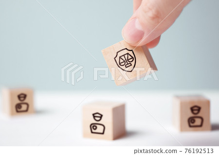 Justice and police interaction concept on abstract wooden blocks 76192513