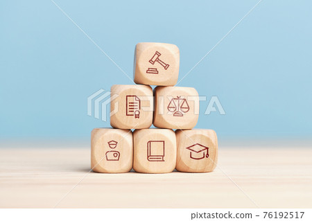 Concept of the system of work of court and justice on a pyramid of wooden blocks 76192517