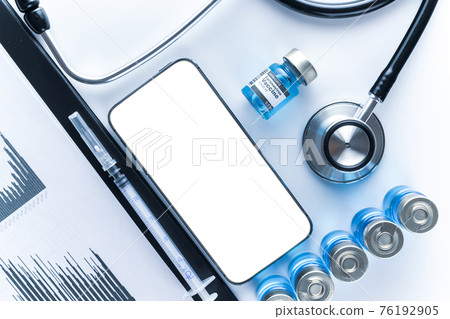 Phone mockup. Medical equipment: doctor stethoscope, hospital healthcare charts, syringe with needle and black smartphone with blank screen. Mock up generic device. Phone mockup. Medical equipment: doctor stethoscope, hospital healthcare charts, syringe with needle and black smartphone with blank screen. Mock up generic device. 76192905