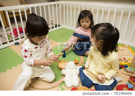 Boys and girls playing in the kids space Boys and girls playing in the kids space 76196668
