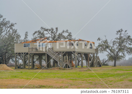 Powerful Hurricane Laura, removed the roof and destroyed this house at Cameron in Cameron Parish, Louisiana 76197311