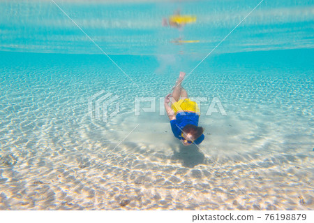 Child snorkeling. Kids underwater. Beach and sea. Child snorkeling. Kids underwater. Beach and sea. 76198879