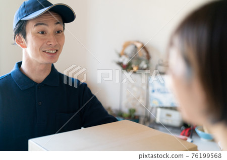 Staff delivering packages Staff delivering packages 76199568