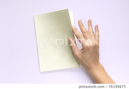 flat lay stationery, hand open green book 76199875