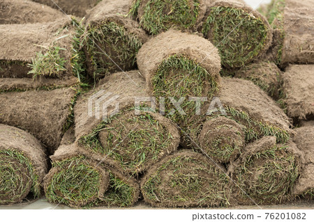 the rolled grass is stacked, ready for gardening, concept the rolled grass is stacked, ready for gardening, concept 76201082