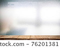 Wood plank table top on abstract backgrounds, characteristics of the light strikes the surface, causing noise and grain texture 76201381