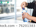 Woman opening bottle of water ,Don't forget to hydrate yourself 76201383