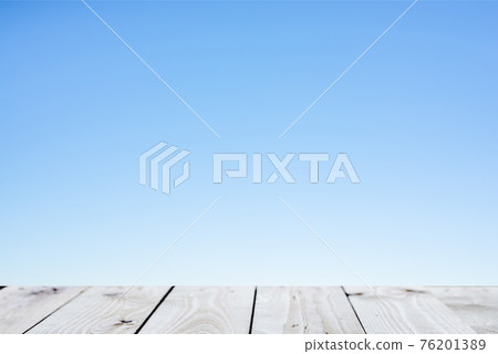 Wood plank table top on blue background Wood plank table top on blue background 76201389
