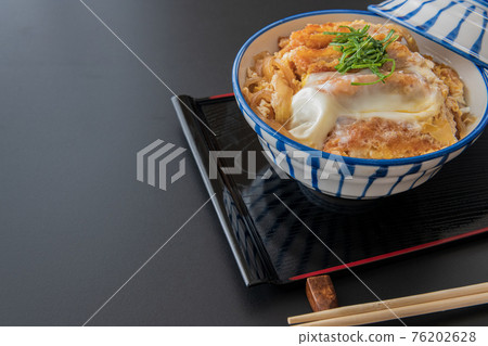 Katsudon bowl black background close-up image material 76202628
