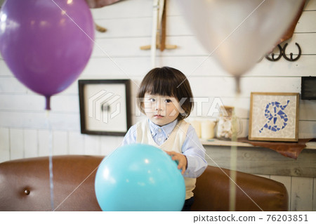 Boys playing with balloons Boys playing with balloons 76203851