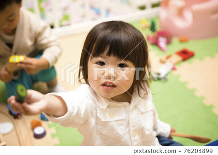 Boys and girls playing with toys Boys and girls playing with toys 76203899