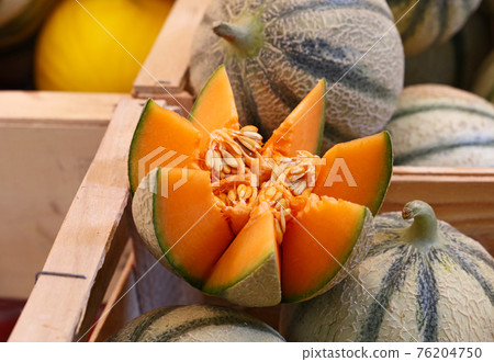 Close up fresh cantaloupe melons on retail display 76204750