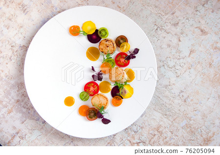 Scallop poele, bright appetizer of colorful vegetables 76205094