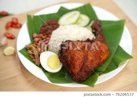 Close-up of Nasi Lemak dish with chicken drumstick Close-up of Nasi Lemak dish with chicken drumstick 76206537