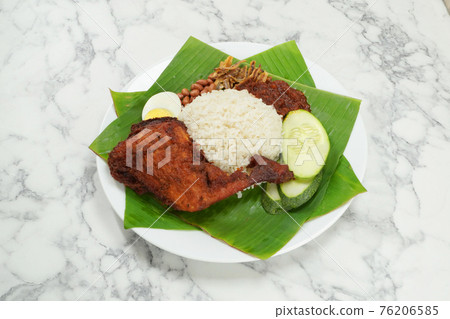 Nasi Lemak dish with chicken drum stick on marble surface 76206585