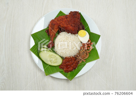 Nasi Lemak dish with chicken drum stick on white wooden verneer 76206604