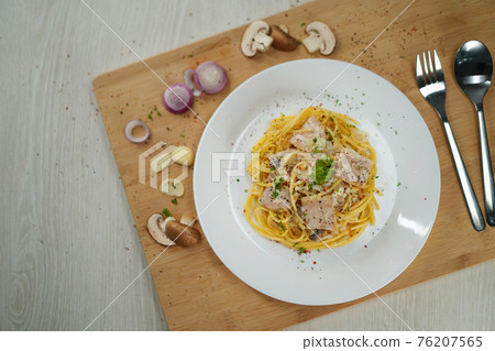 spaghetti carbonara served on wooden table lunch dinner. 76207565