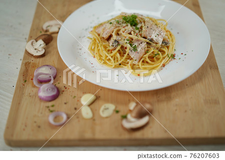 spaghetti carbonara served on wooden table lunch dinner. 76207603