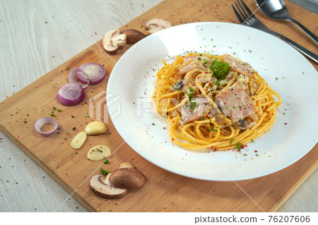 spaghetti carbonara served on wooden table lunch dinner. 76207606