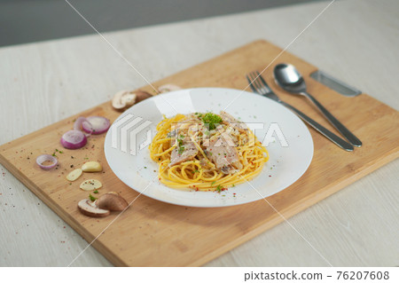 spaghetti carbonara served on wooden table lunch dinner. 76207608