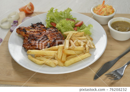 delicious plate of western food chicken chop with fries and salad delicious plate of western food chicken chop with fries and salad 76208232