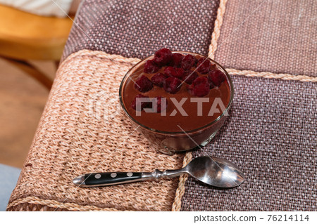 Chocolate mousse dessert with cherries in bowls. 76214114