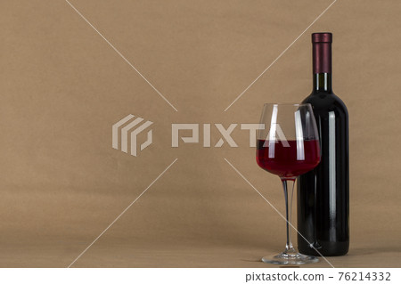 Wine bottle and glass . Space for text. Wine bottle and glass . Space for text. 76214332