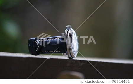 A watch with a large leather belt and a sparkling glass dome-shaped windshield 76214491