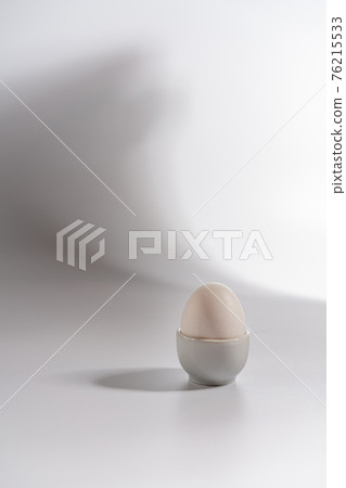 White egg on a white background White egg on a white background 76215533