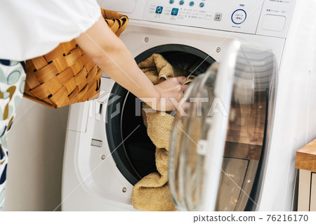 Woman washing at home 76216170