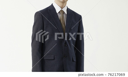 Portrait of a man in a business suit, gray background 76217069