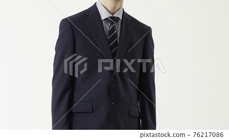 Portrait of a man in a business suit, gray background 76217086