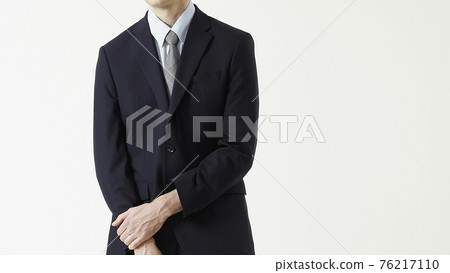 Portrait of a man in a business suit, gray background Portrait of a man in a business suit, gray background 76217110