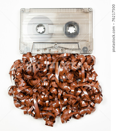 Vintage audio cassette with messed up audio tape 76217500