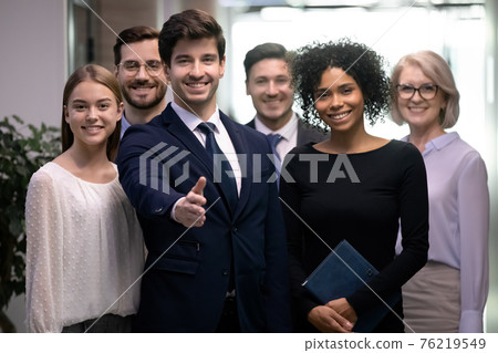 Smiling employees meet new worker into team Smiling employees meet new worker into team 76219549