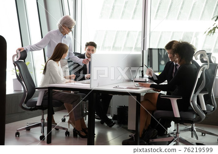 Multiethnic employees work in coworking office workspace Multiethnic employees work in coworking office workspace 76219599