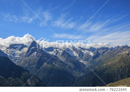 Panorama view of dramatic sky and mountains scene in national park Dombay Panorama view of dramatic sky and mountains scene in national park Dombay 76221045