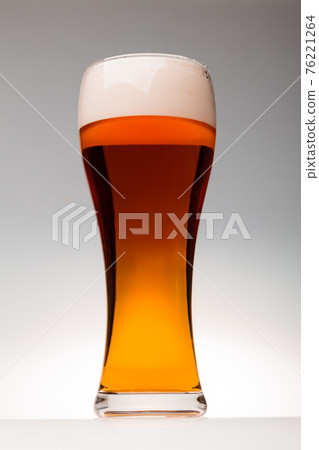 Tall glass of pilsner beer with head Tall glass of pilsner beer with head 76221264
