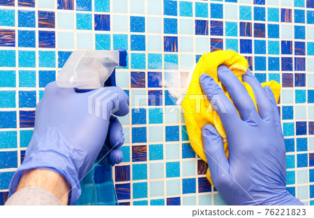 House chores - wiping bathroom wall with cleaning cloth and sprayer House chores - wiping bathroom wall with cleaning cloth and sprayer 76221823
